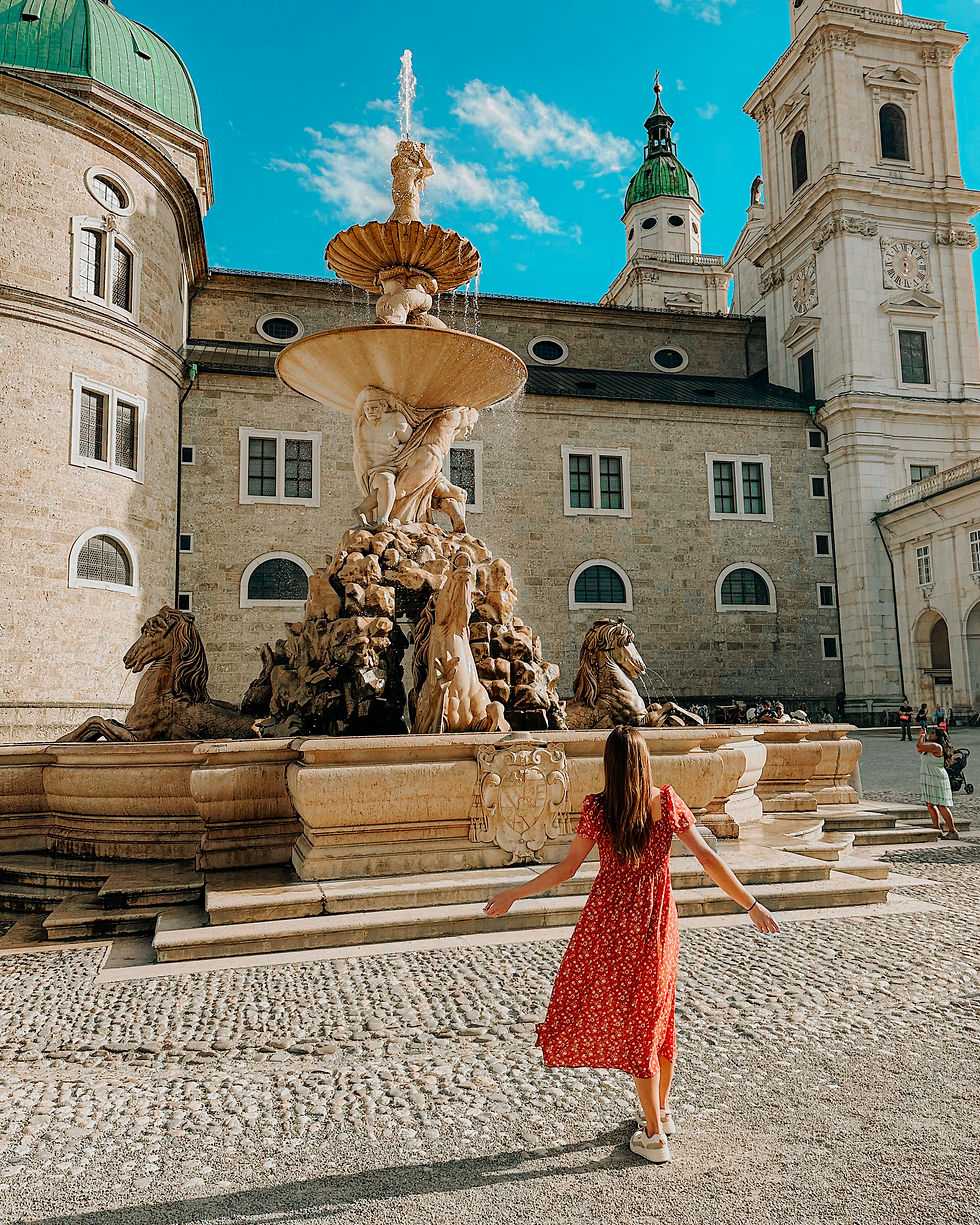 woman in front of Resident Fountain in Salzburg