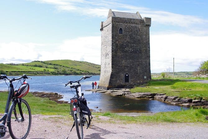 Two electric cycles outside a place of tourist interest in Mayo
