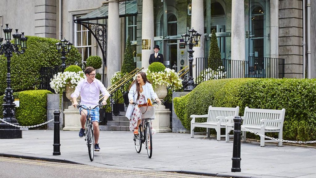 A couple on bicycles at the Great Southern in Killarney