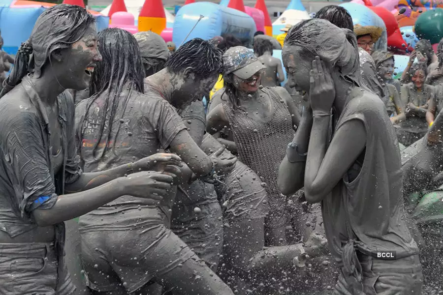 Several people full of mud come together in July, in the coastal town of Boryeong, South Korea, for the Mud Festival.