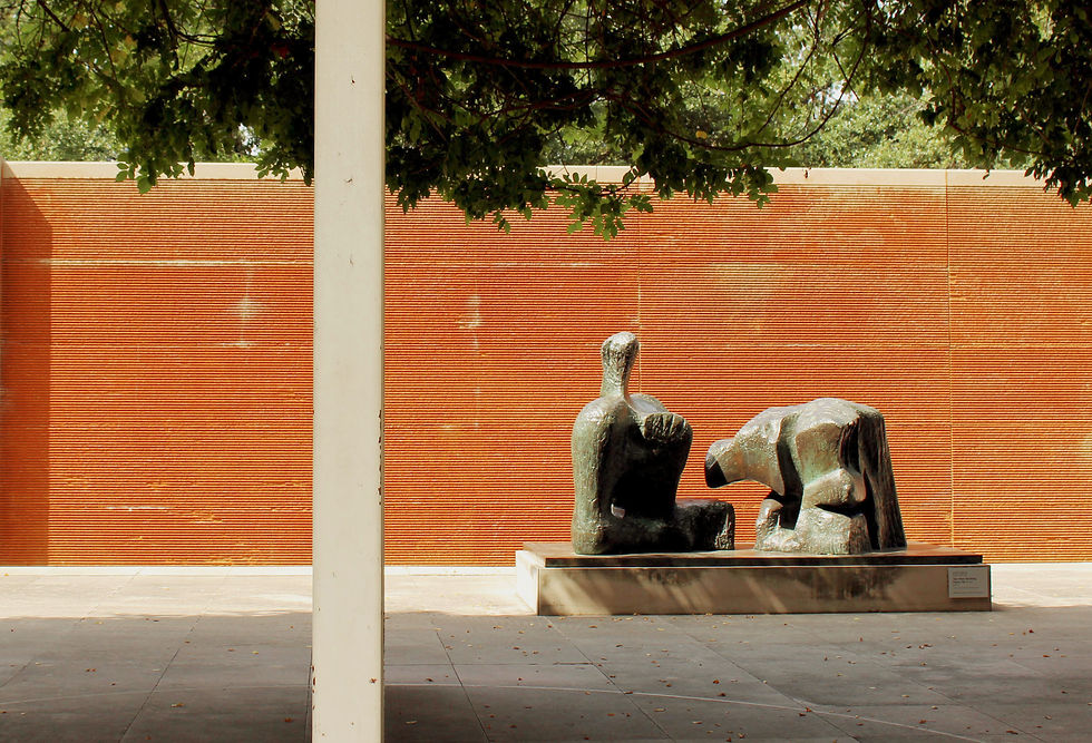 “Two Piece Reclining Figure No. 3,” a 1961 bronze sculpture by artist Henry Moore, is displayed in an outdoor courtyard at the Dallas Museum of Art on Sept. 28, 2025. (©2025 Rubyanne Moley/SMU)