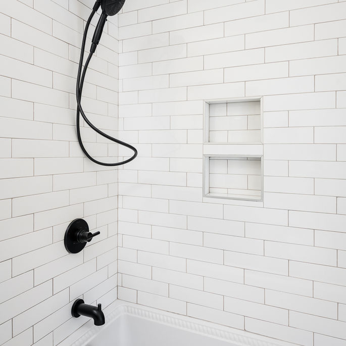 New 2-car garage addition with seamless brick match to 73-year-old home by KEEN Building CLT