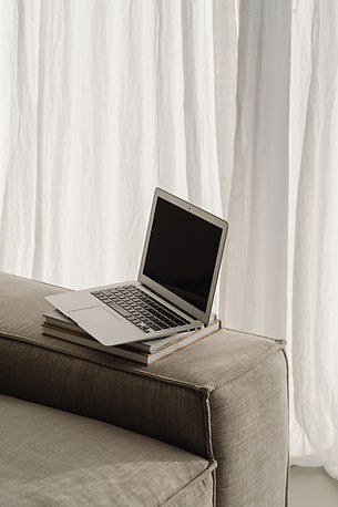 kaboompics_home-office-on-the-sofa-books-laptop-macbook-29690.jpg