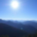 a sunny day with blue sky and mountains in the background.jpg