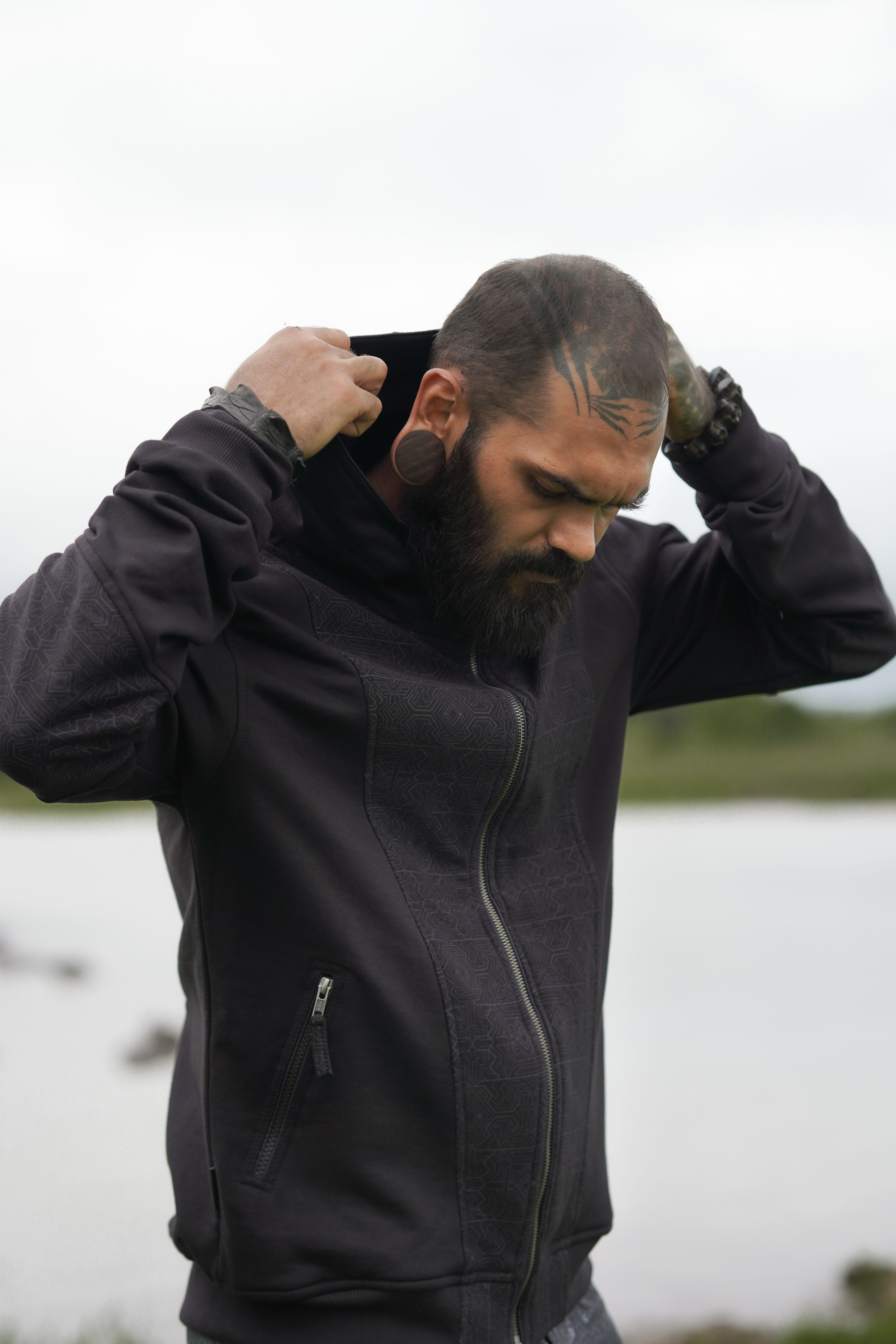 Front view of Magma Codex cotton fleece urban wear hoodie by Baabio Clothing with bold psychedelic print