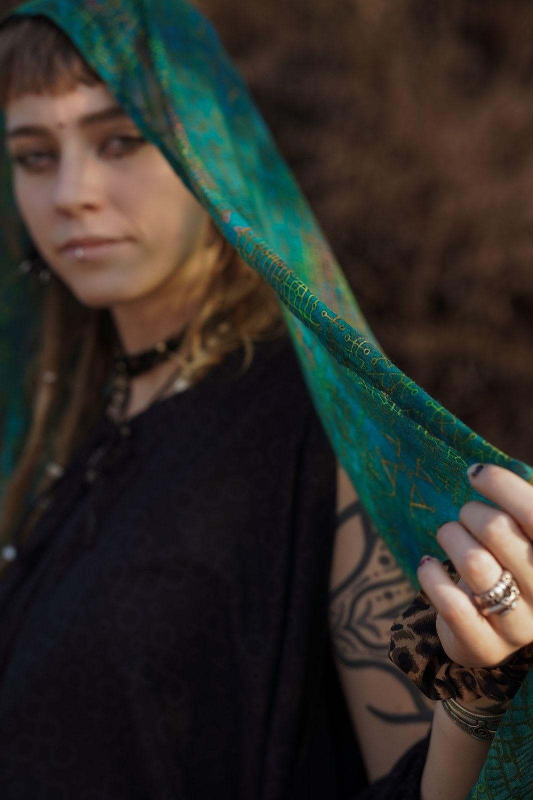 Bold women wearing art wear scarf over head