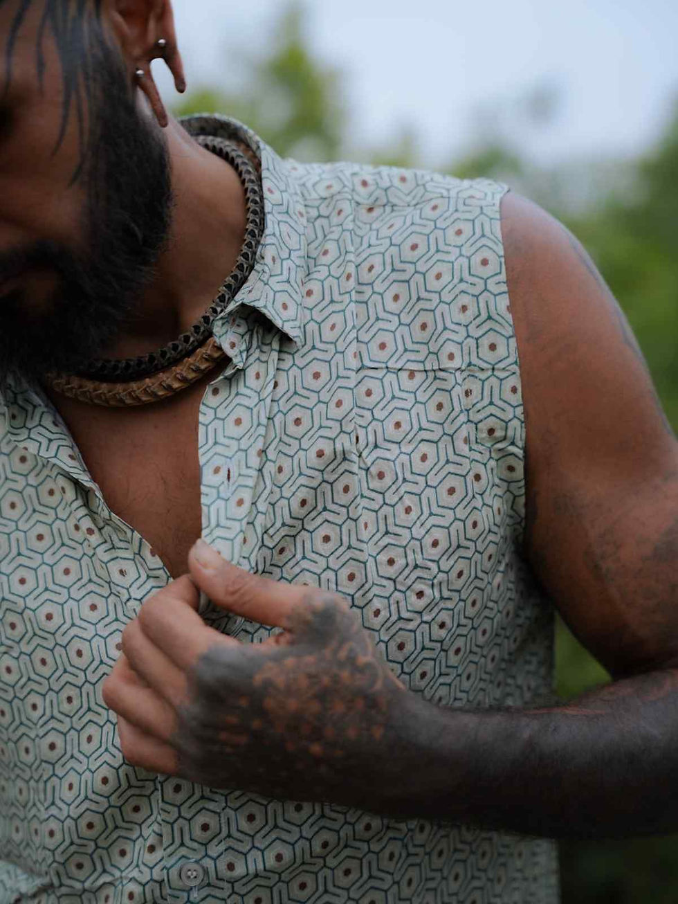 Close up view of the honey comb art on the sleeveless bamboo shirt