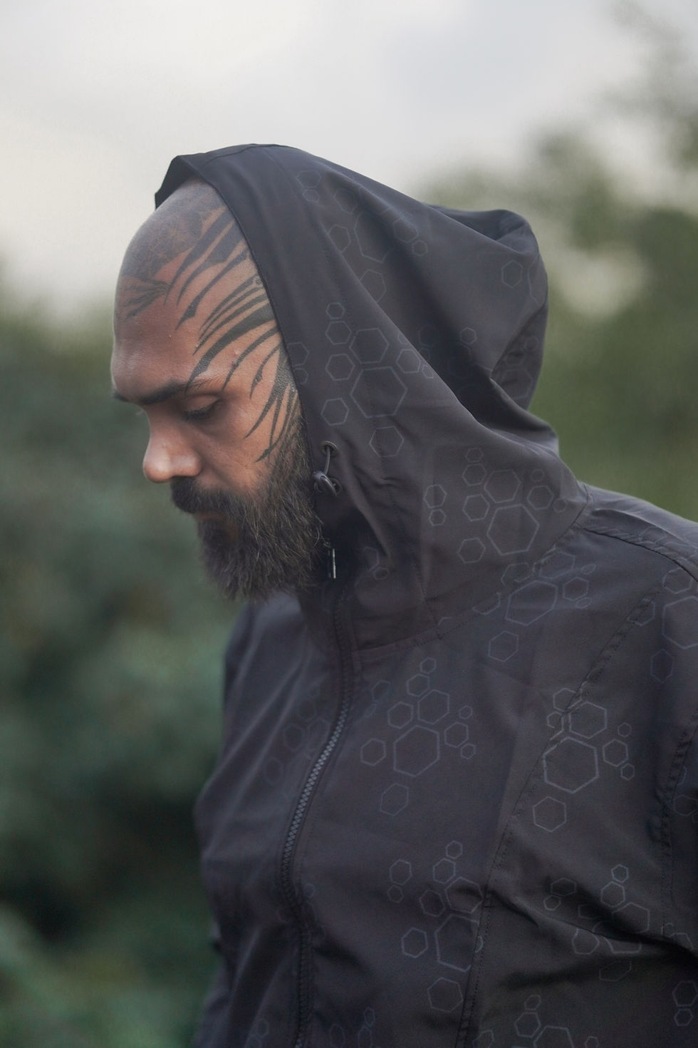 Side close up view of the hood on the art wear coat