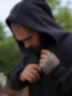 Close up view of zipping the hood of the art wear hoodie