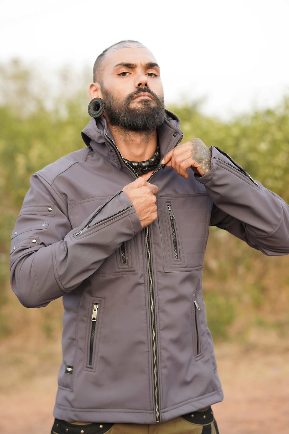 Zipping the closure of Armor Jacket