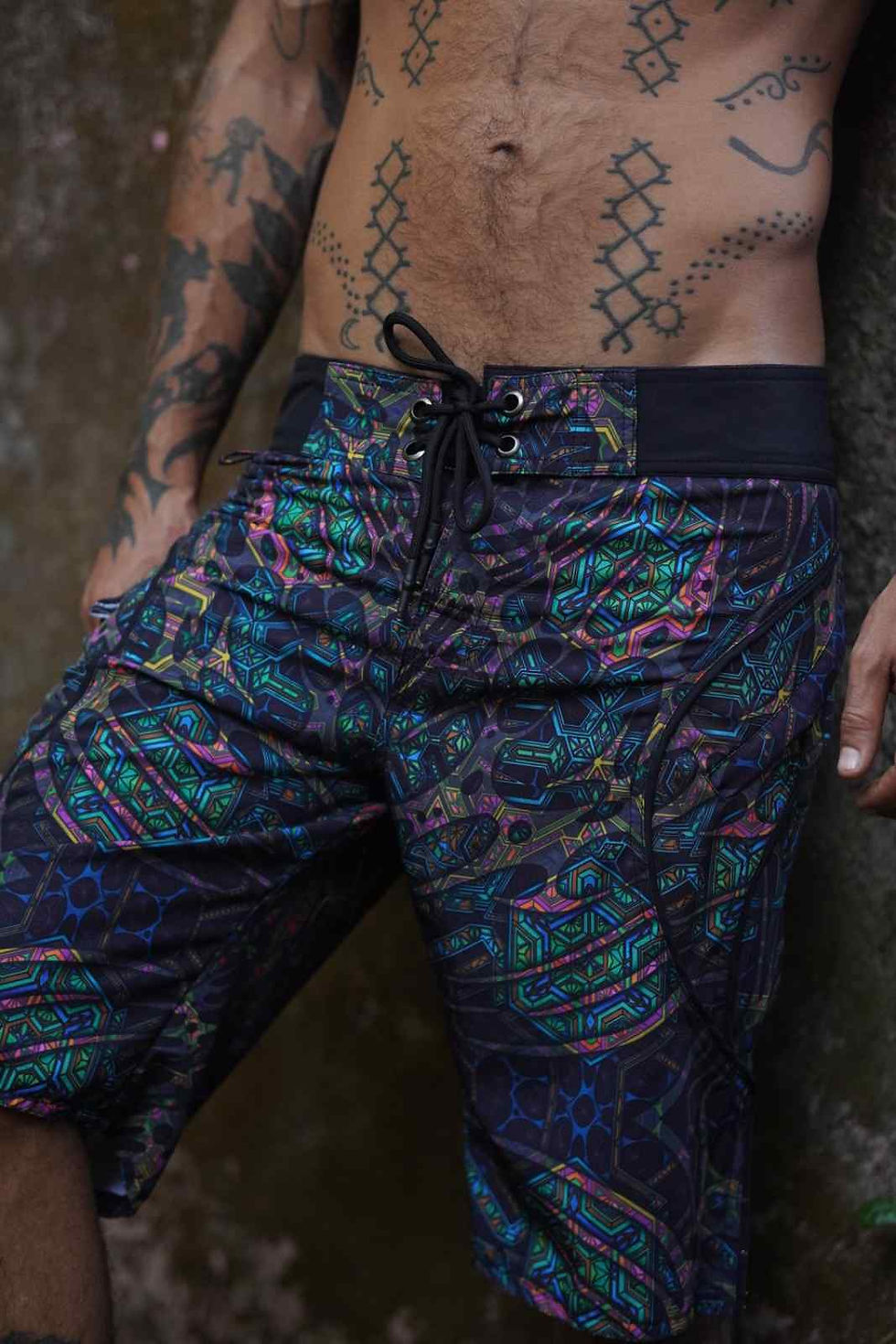 Thumbnail: Close up waist raise view of the men's swim wear shorts