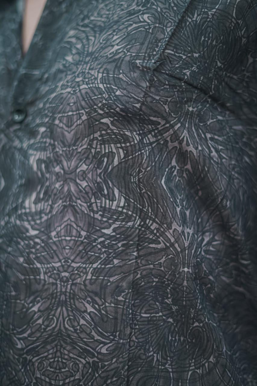 Thumbnail: Close up view of the artwork on shirt