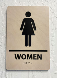 ADA Compliant Raised Black Graphic Bathroom Sign on Wood