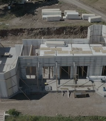 Aerial view shows a building under construction, Concrete Struksures CLIENT.
