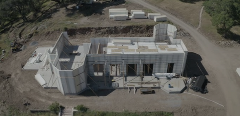Aerial view shows a building under construction, Concrete Struksures CLIENT.