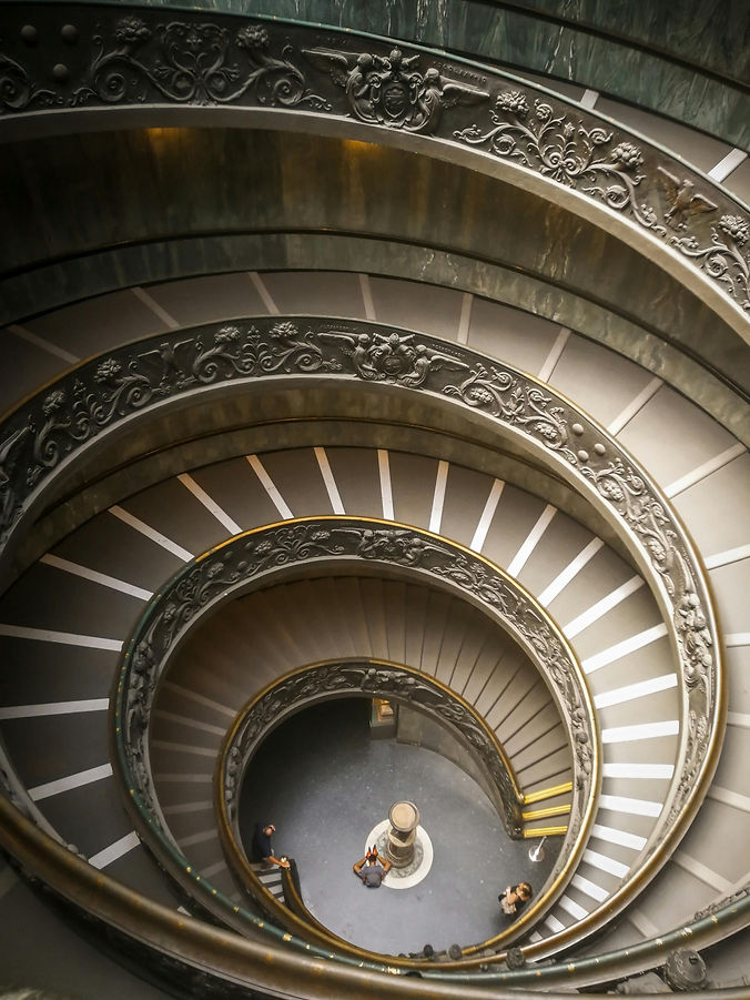 An artistic set of stairs spiraling upward.