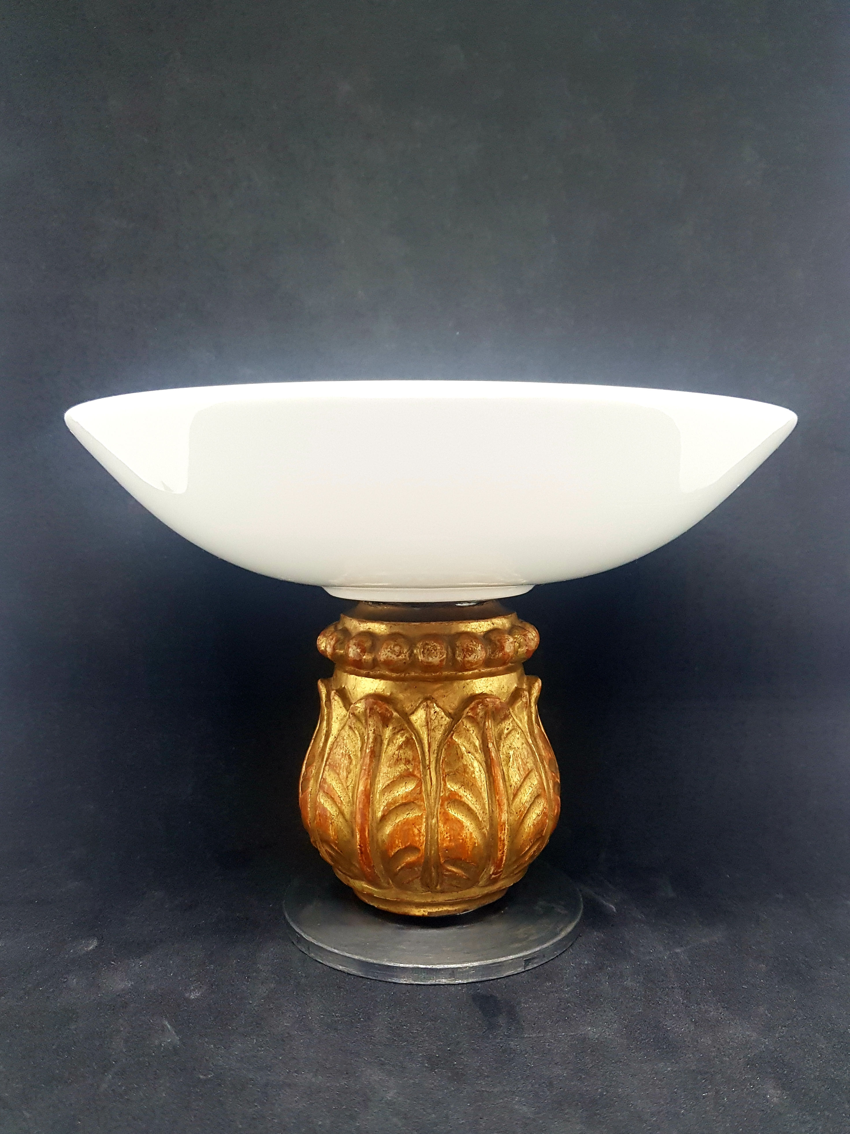 White porcelain bowl with antique carved wood base
