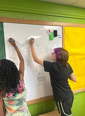 Youth drawing on white board