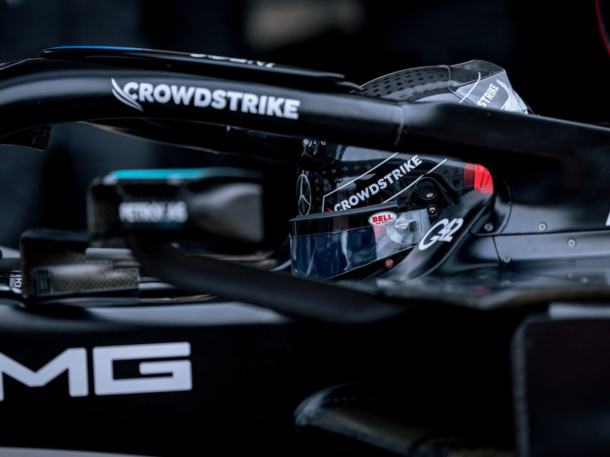 CrowdStrike branding on the halo and driver's helmet of the Mercedes-AMG PETRONAS F1 car