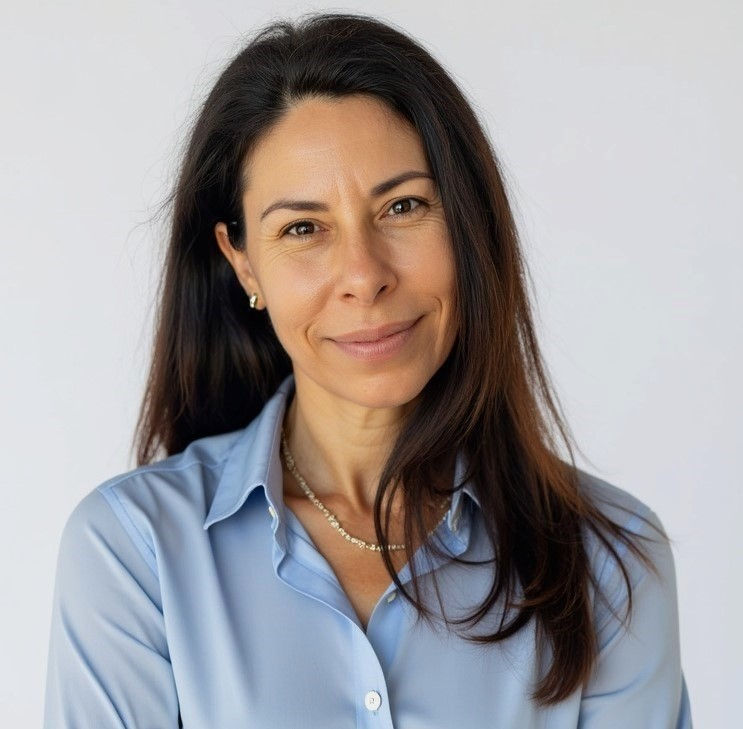 Headshot of a woman with long brown hair