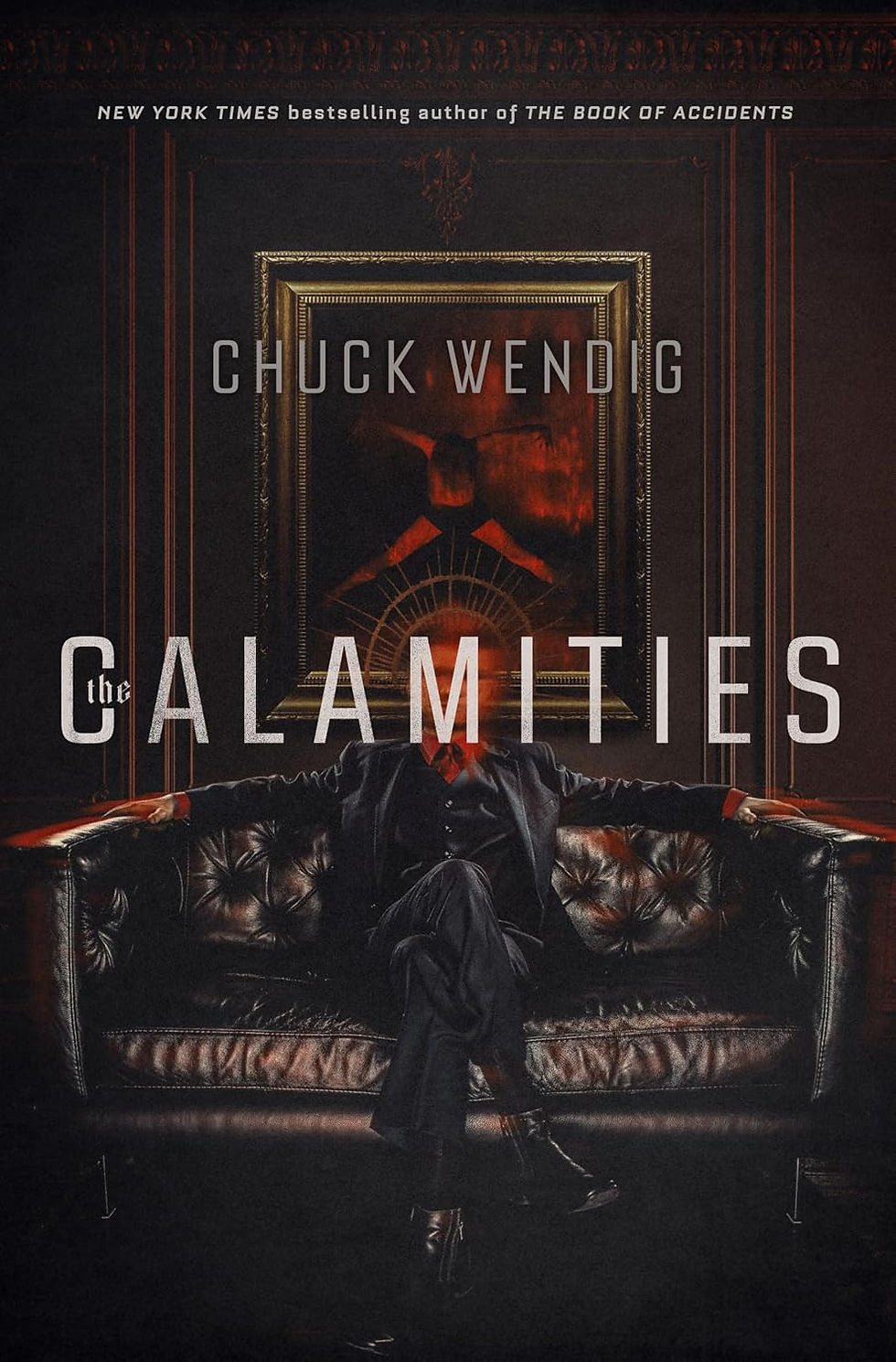 Dark book cover showing a man in a black suit on a leather couch, red glow behind him, titled The Calamities by Chuck Wendig.