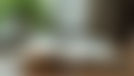 An open book on a wooden table showcasing its pages