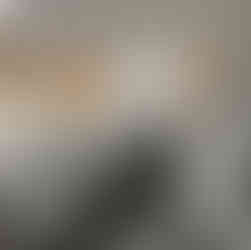 After renovation: modern treatment room with a comfortable treatment bed, advanced skincare equipment, and clean, sleek design.