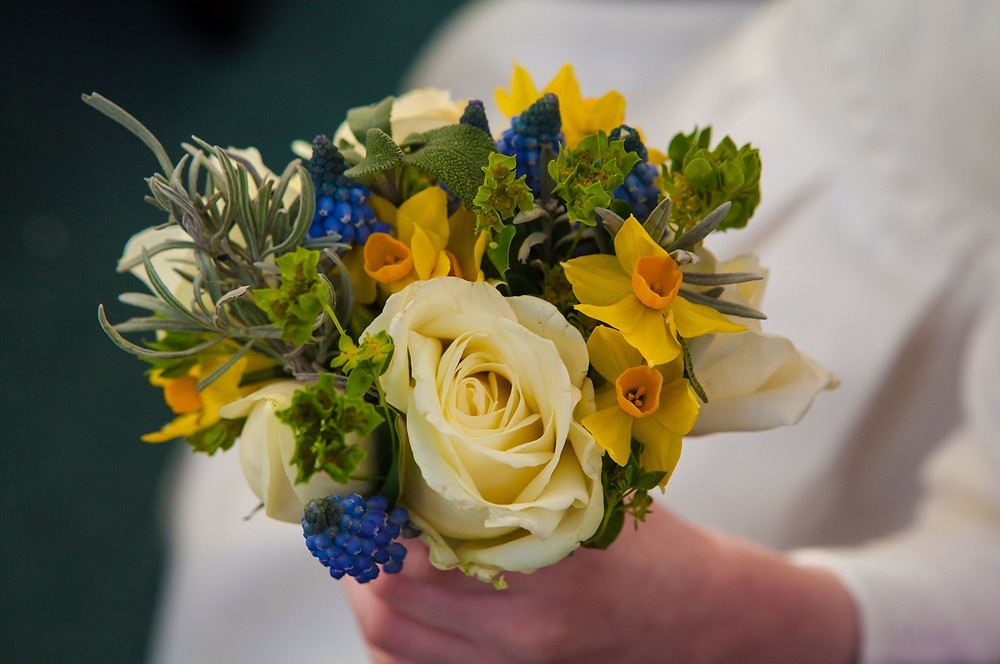 A beautiful Spring flower girls bouquet designed by Surrey wedding florist Francesca Sharp Flowers for Farnham Castle wedding