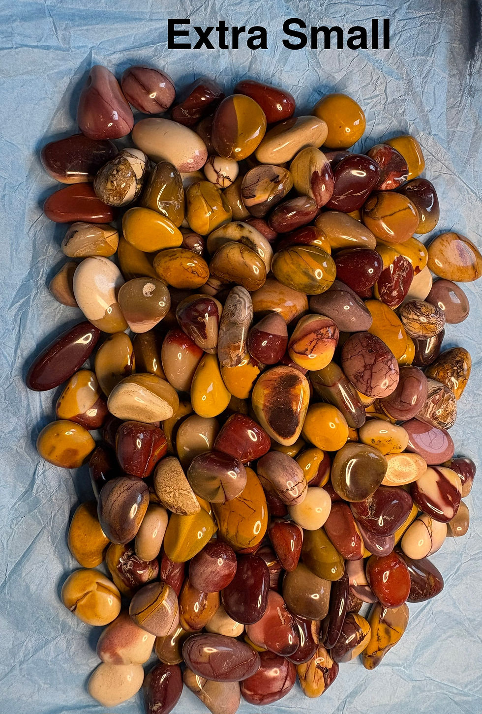 Pile of polished stones with various colors, sparkle in stone.