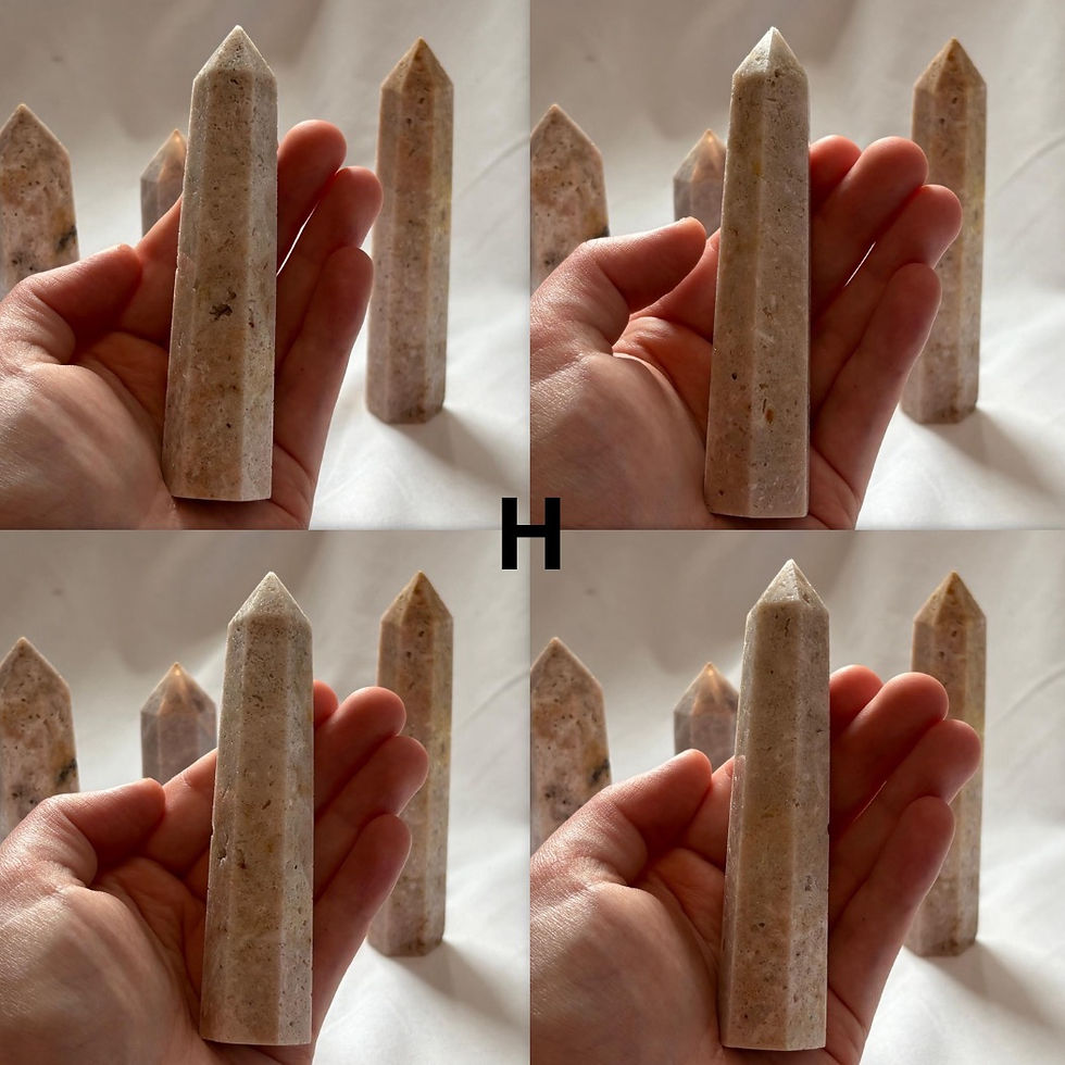 Thumbnail: Hand holding a Zebra Jasper Small Tower amidst others; the background is white.
