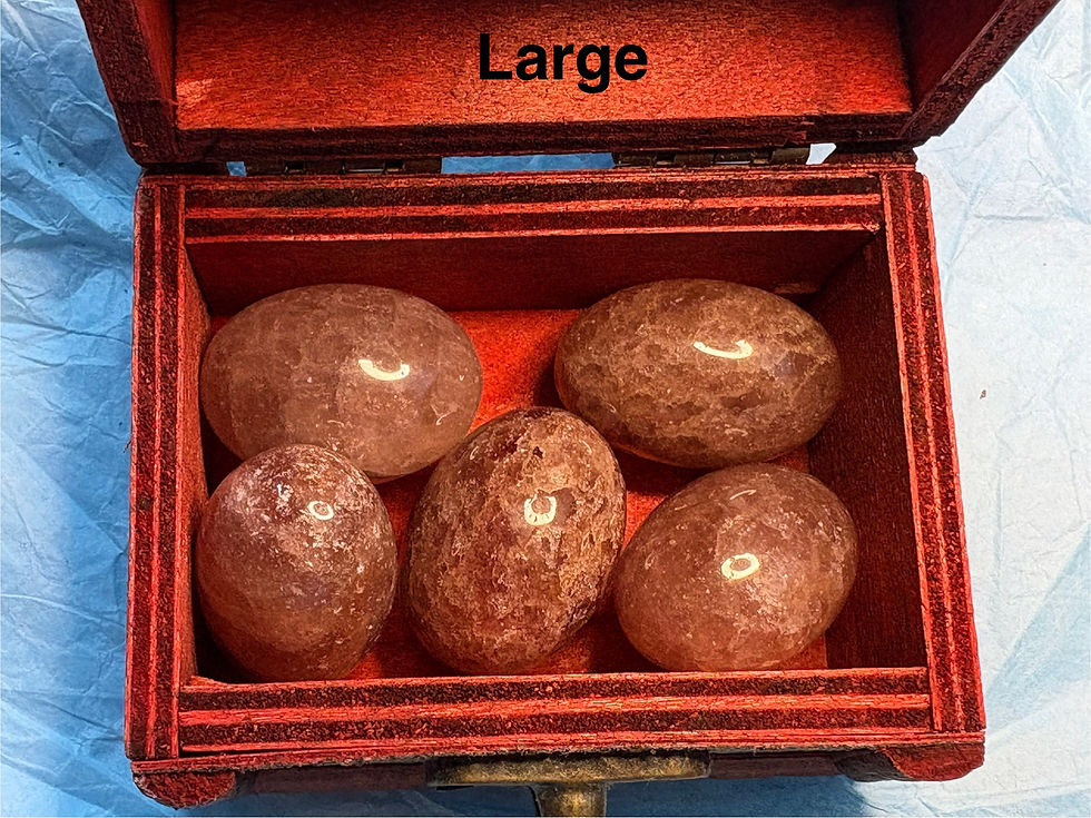 Thumbnail: Large, red stones in wooden box, sparkle in stone, detail. 