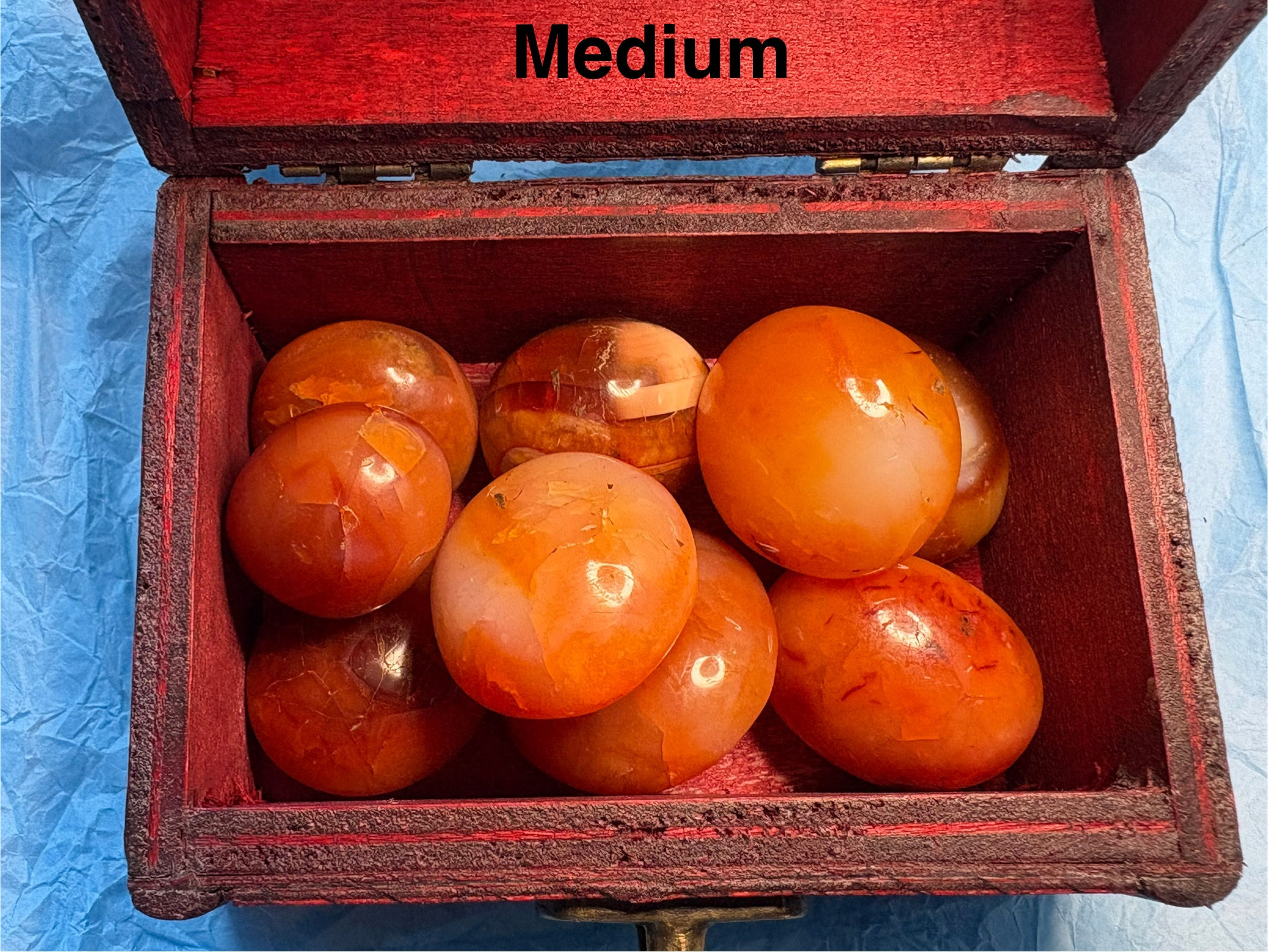 Orange stones inside box, text reads Medium, Hare Carving Small, Sparkle In Stone.