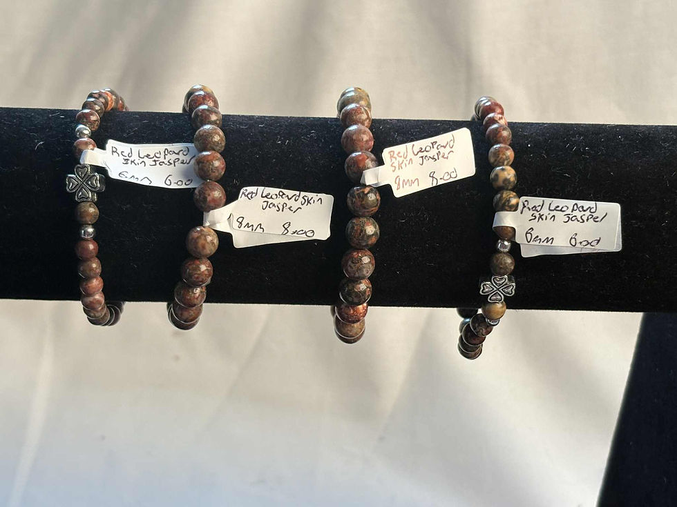 Beaded bracelets with price tags: Red Jasper, 8mm, in display setting.