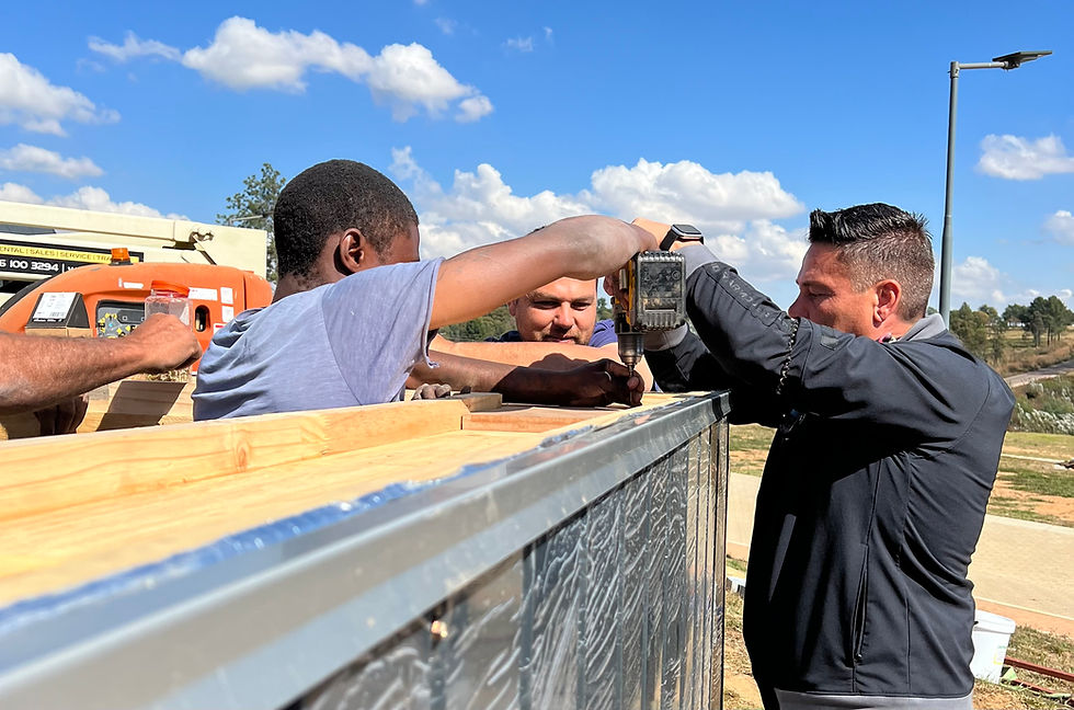 Arthur Bezuidenhout working alongside his team in Country Gardens Estate to build a Maxxliving home.
