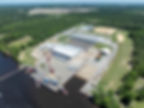 Aerial view of The Whiskey Project Group USA's advanced 50-acre facility, featuring integrated shipbuilding and warehousing, strategically positioned along the Chowan River in Edenton, NC.