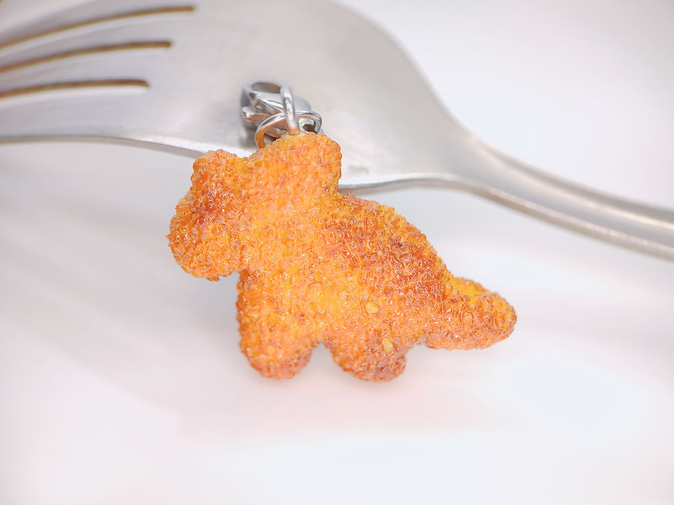Miniatura: Dijes de Nuggets de dinosaurio