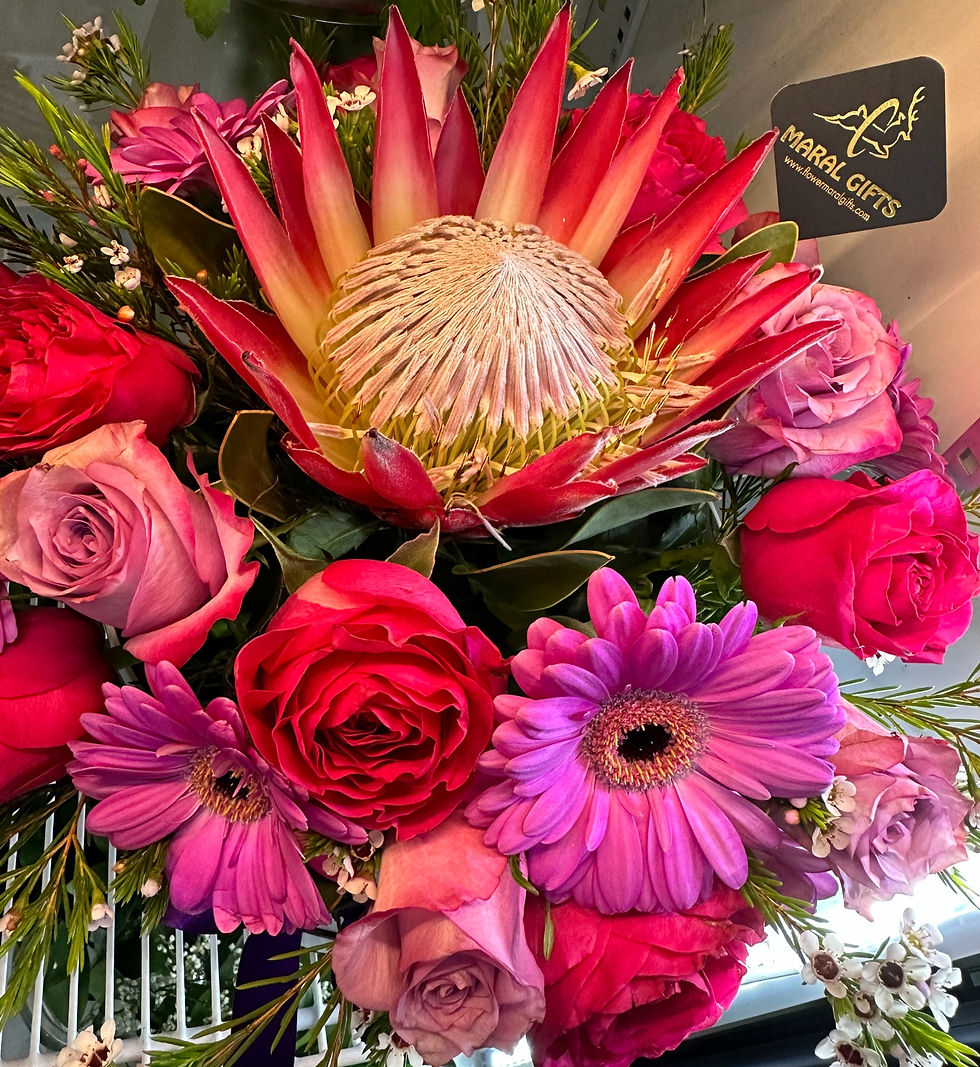 Protea and purple Flower combination in a box