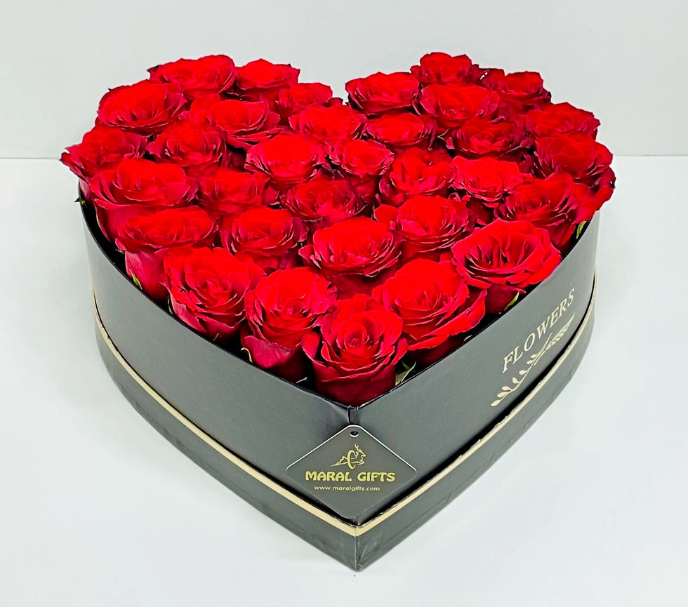 Heart Flower arrangement in a black heart boxes in Dubai