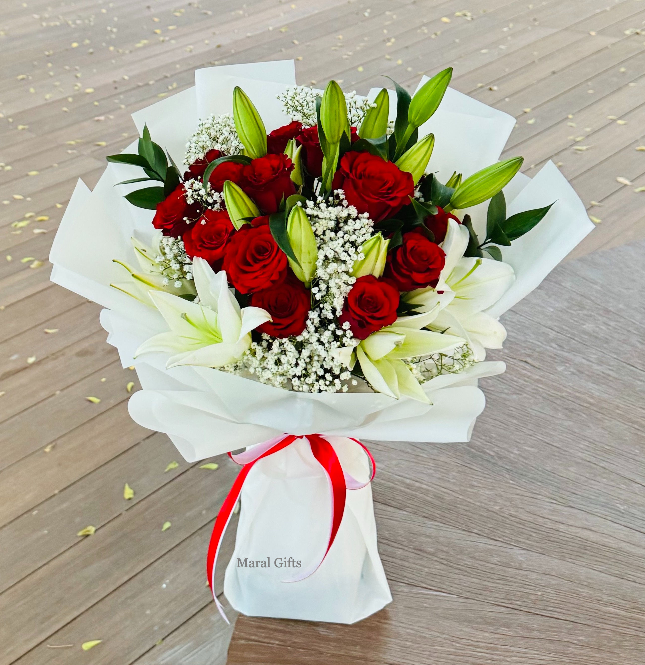 Lily and red roses bouquet.