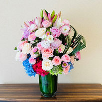 Garden roses and lily flower vase.
