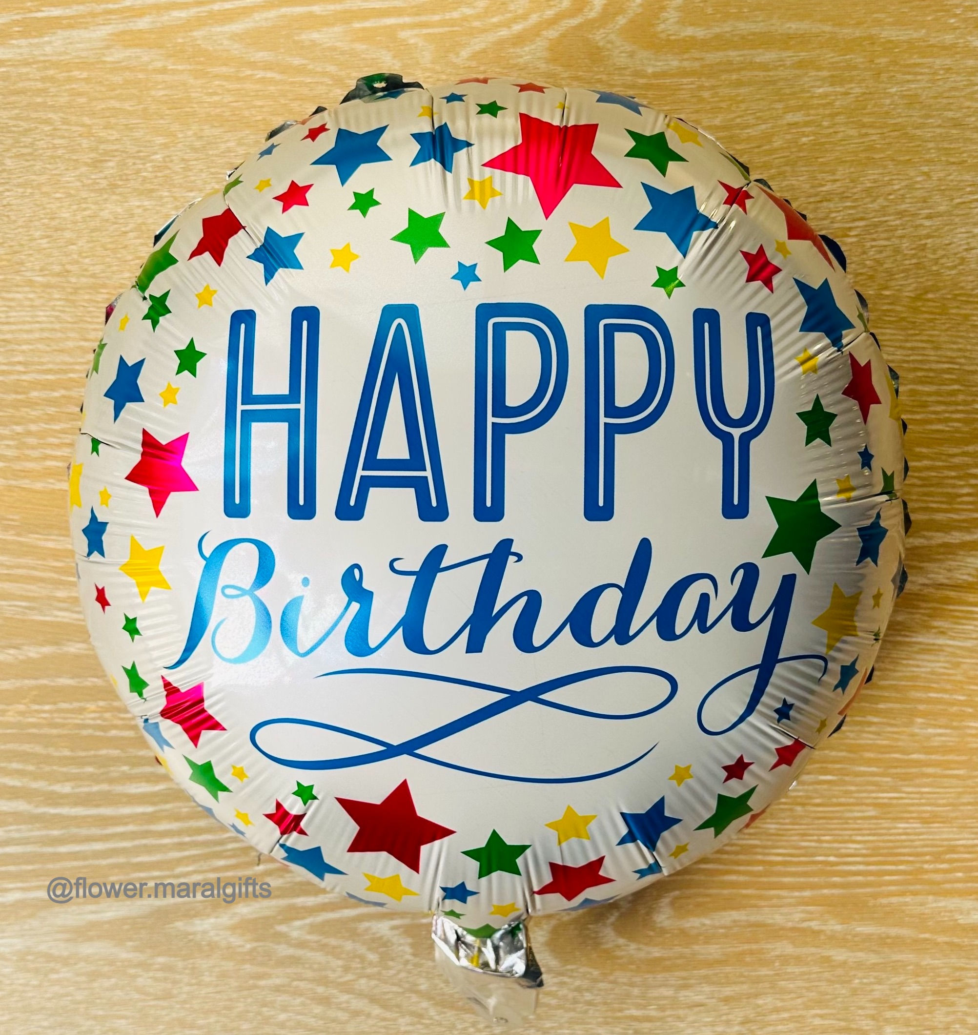 White happy birthday balloon with stars