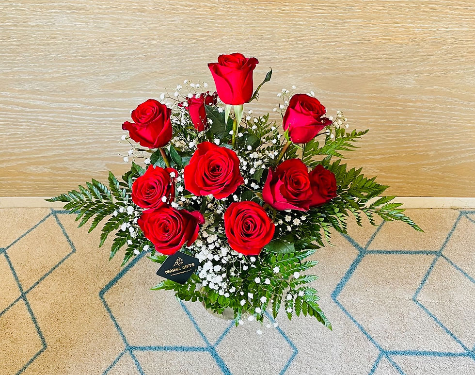 Red roses flower with gypsophila in a vase