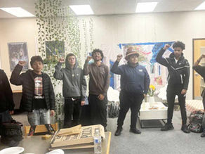 Pittsburg High School brothers standing and doing their IYT Creed while posing for a group photo.
