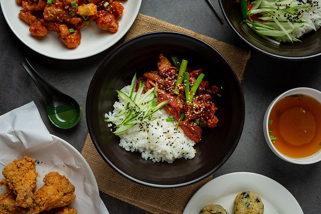 stir-fried-pork-with-korean-sauce-dark-background-min.jpg
