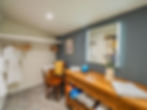 Spacious dressing area with clothes storage and dressing table at Carmagnac