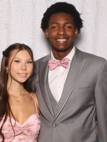 Couple posing together at a Raleigh wedding photo booth