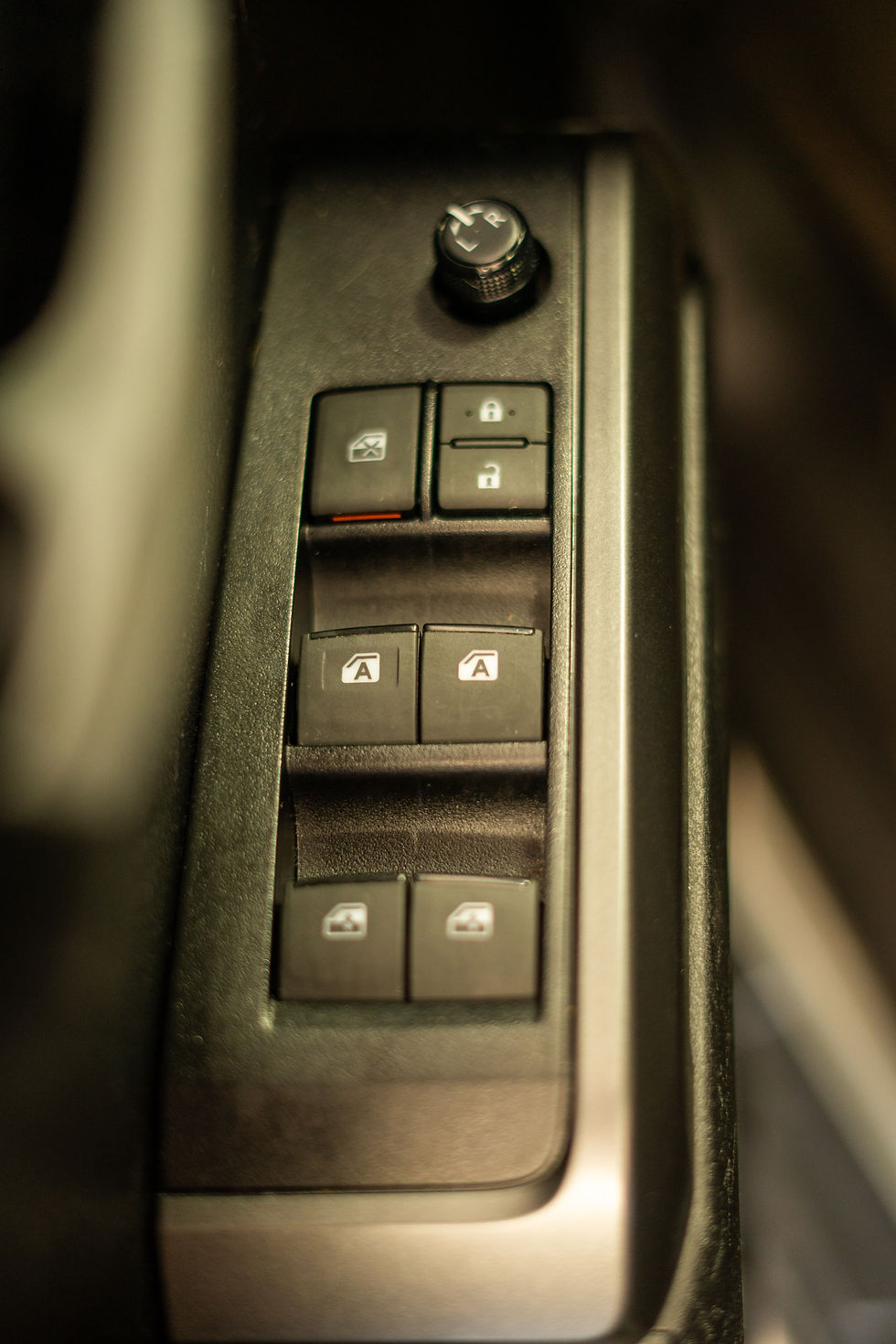 Interior of vehicle window switches.