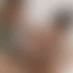 Family cuddling newborn baby