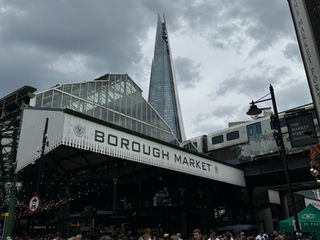 Crowds outside Borough Market with the Shard rising behind