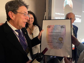 Charles Ribak receives Lifetime Award Certificate designed by artist Dawn Hunter